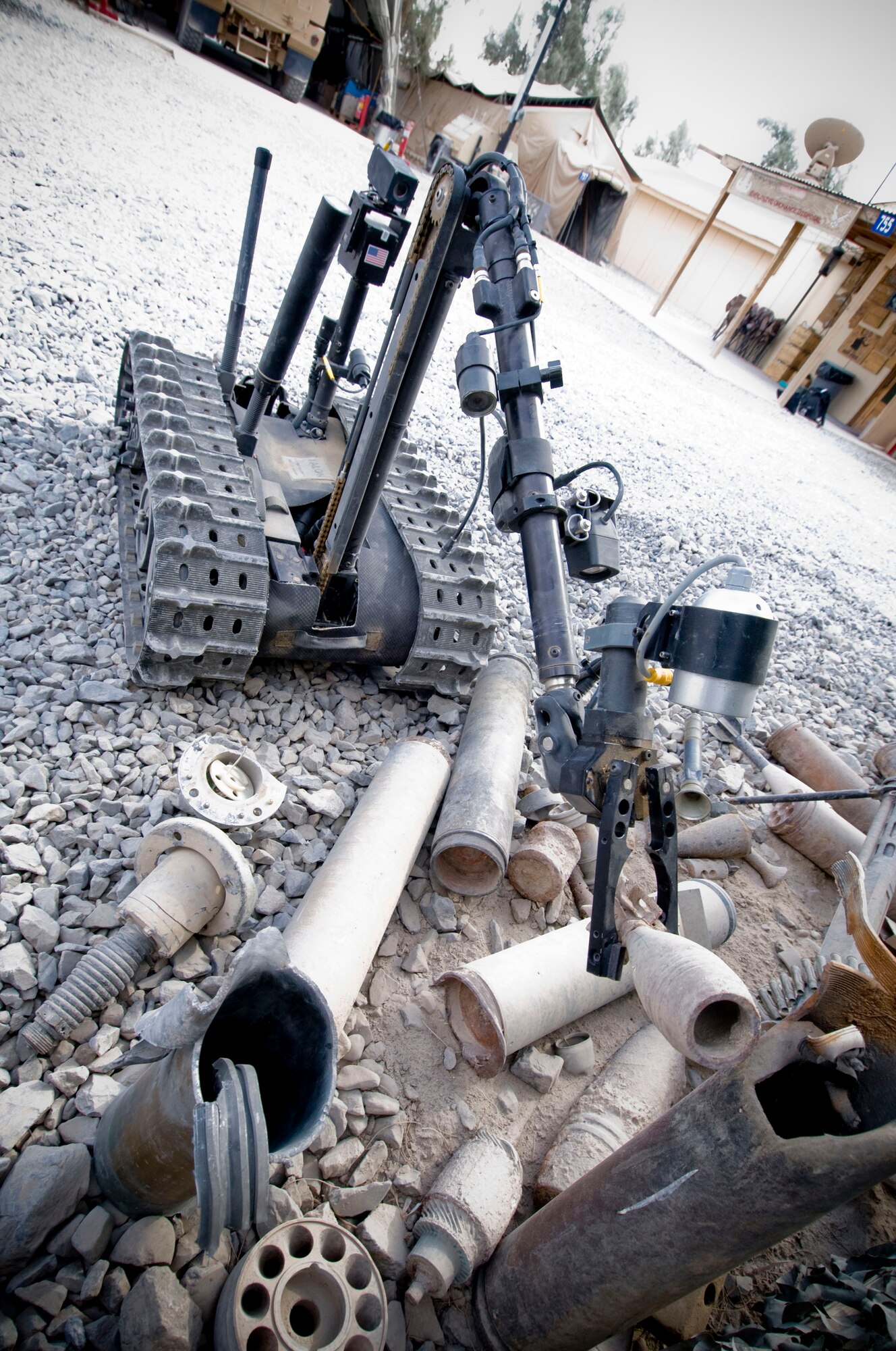 A Talon explosive ordnance disposal robot picks up a simulated piece of unexploded ordnance at Kandahar Air Field, Afghanistan. The Talon is one of two types of robots the EOD teams use in lieu of human contact with potentially dangerous situations. (U.S. Air Force photo by Staff Sgt. Samuel Morse/Released)