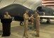 SOUTHWEST ASIA -- Maj. Robert Matlock (right), 12th Expeditionary Reconnaissance Squadron commander, and Col. Kyle Garland, 380th Expeditionary Operations Group commander, case the guide-on as part of the inactivation ceremony here Nov. 1. The 12th ERS inactivated, but is not going far. The assets and mission have been picked up by the 99th ERS. (U.S. Air Force photo/Tech. Sgt. Christopher A. Campbell)(released)