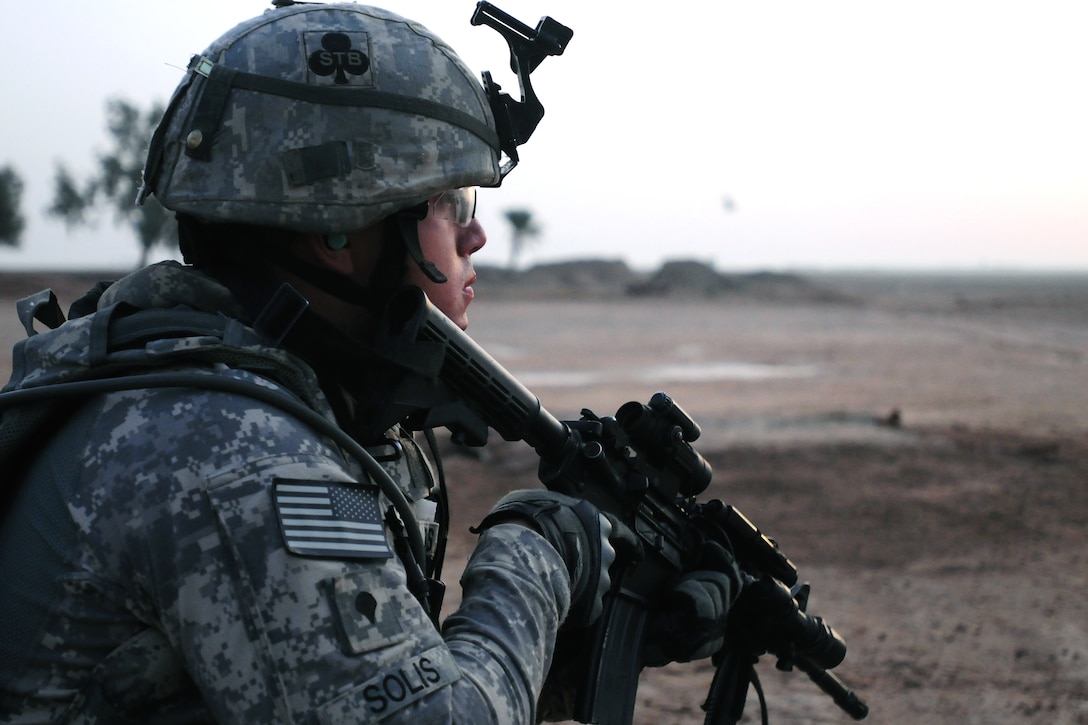 U.S. Army Spc. Edgar Solis pulls security during Operation Syme in Tikrit, Iraq, Oct. 28, 2008. The soldiers are assigned to the 101st Airborne Division's Company B, 1st Special Troops Battalion, 1st Brigade Combat Team. Operation Syme was an air assault operation targeting insurgent fighters in the desert areas west of Tikrit.