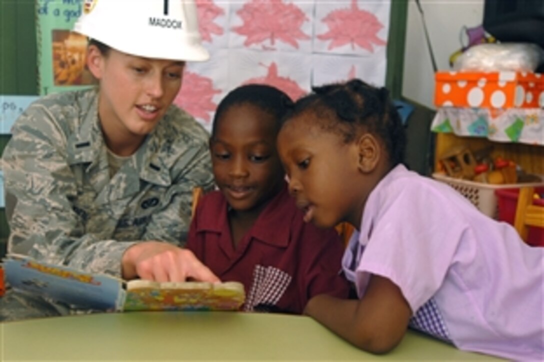 U.S. Air Force 1st Lt. Lindsey Maddox reads to children at a daycare center in the Carribean where engineers from the USS Kearsarge are making renovations as part of Continuing Promise 2008, Oct. 30, 2008. Maddox is temporarily assigned to the USS Kearsarge. Continuing Promise 2008 is a multi-national humanitarian effort. 