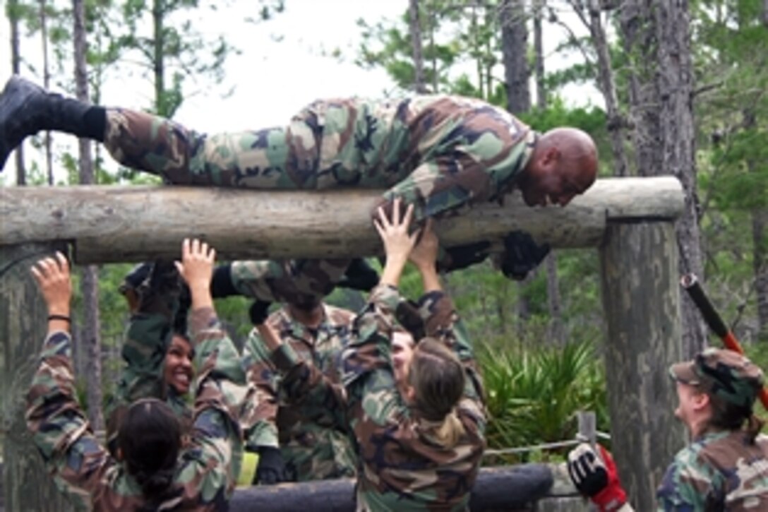 U.S. Air Force Senior Master Sgt. Nate Tennyson tackles the 823rd Red Horse Squadron's obstacle course during a Silver Flag exercise on Tyndall Air Force Base, Fla., Nov. 2, 2008. Silver Flag provides contingency training in which airmen from various career fields train and interact in a realistic environment.