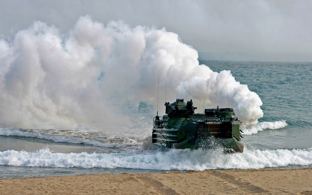 An amphibious assault vehicle operated by Marines, assigned to Battalion Landing Team 3rd Battalion, 1st Marine Regiment, assaults a beach during the bilateral amphibious training exercise Korean Incrimental Training Program 2009.