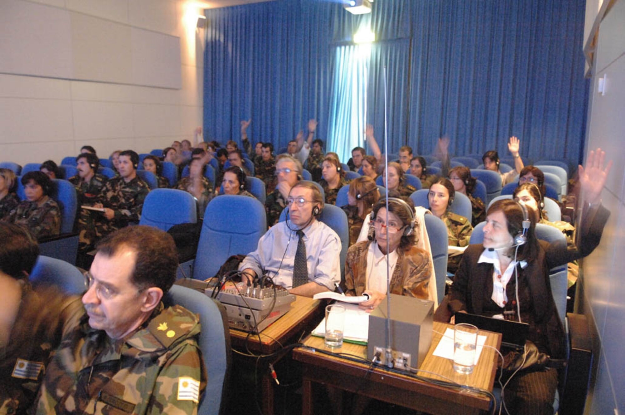 Audience participation was high during an exchange between US Air Force Medics from the Defense Institute for Medical Operation and military medics from Uruguay. A team of translators using wireless headphones for each participant allowed simultaneous translation of the presentations given by both U.S. and host nation medics allowing free flowing dialog during Operation Southern Partner, Nov., 3, 2008. OSP is an in-depth, two-week subject matter exchange emphasizing partnership, cooperation and sharing of information with partner nation Air Forces in Latin America. 
(U.S. Air Force Photo by TSgt Roy Santana, Released)