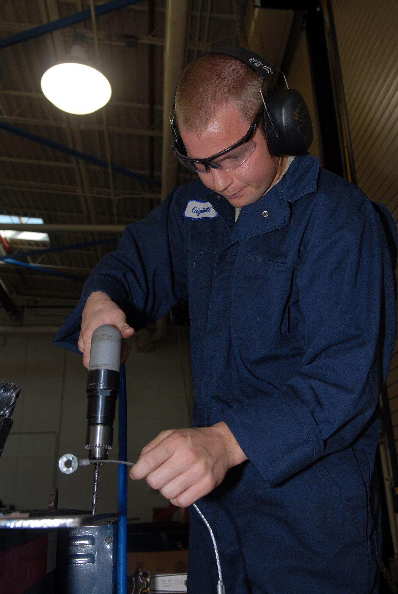 VANDNEBERG AIR FORCE BASE, Calif. --  Airman 1st Class Micheal Gigliotti, 30th Logistic Readiness Squadron, drills a hole to mount a support bracket for an airline handle on Oct. 29. (U.S. Air Force photo / Senior Airman Nicole Roberts)
