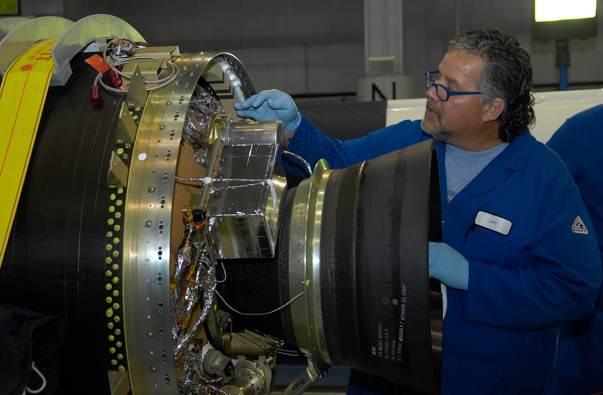 VANDENBERG AIR FORCE BASE, Calif. --  Larry Phipps, an Orbital Science Corporations employee, works on the Stage 3 piece of a motor for a Flight Test Missile 6 at the Orbital Missile Assembly Building on Oct. 28. (U.S. Air Force photo / Airman 1st Class Andrew Lee)