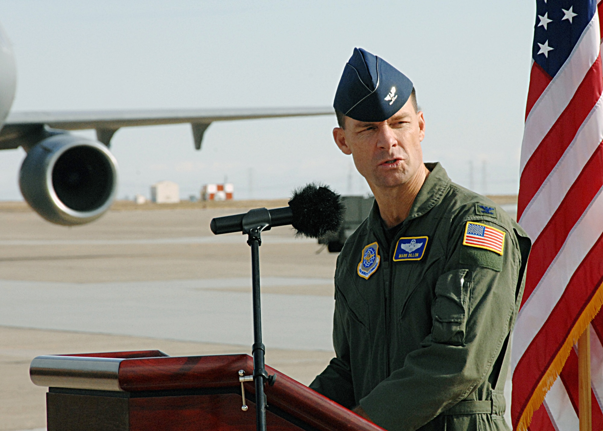 Col. Mark Dillon, 60th Air Mobility Wing commander, addresses the crowd on hand to witness the arrival of the final C-17 "The Spirit of Travis" to Travis Air Force Base Nov. 5. (U.S. Air Force photo/Dave Cushman) 