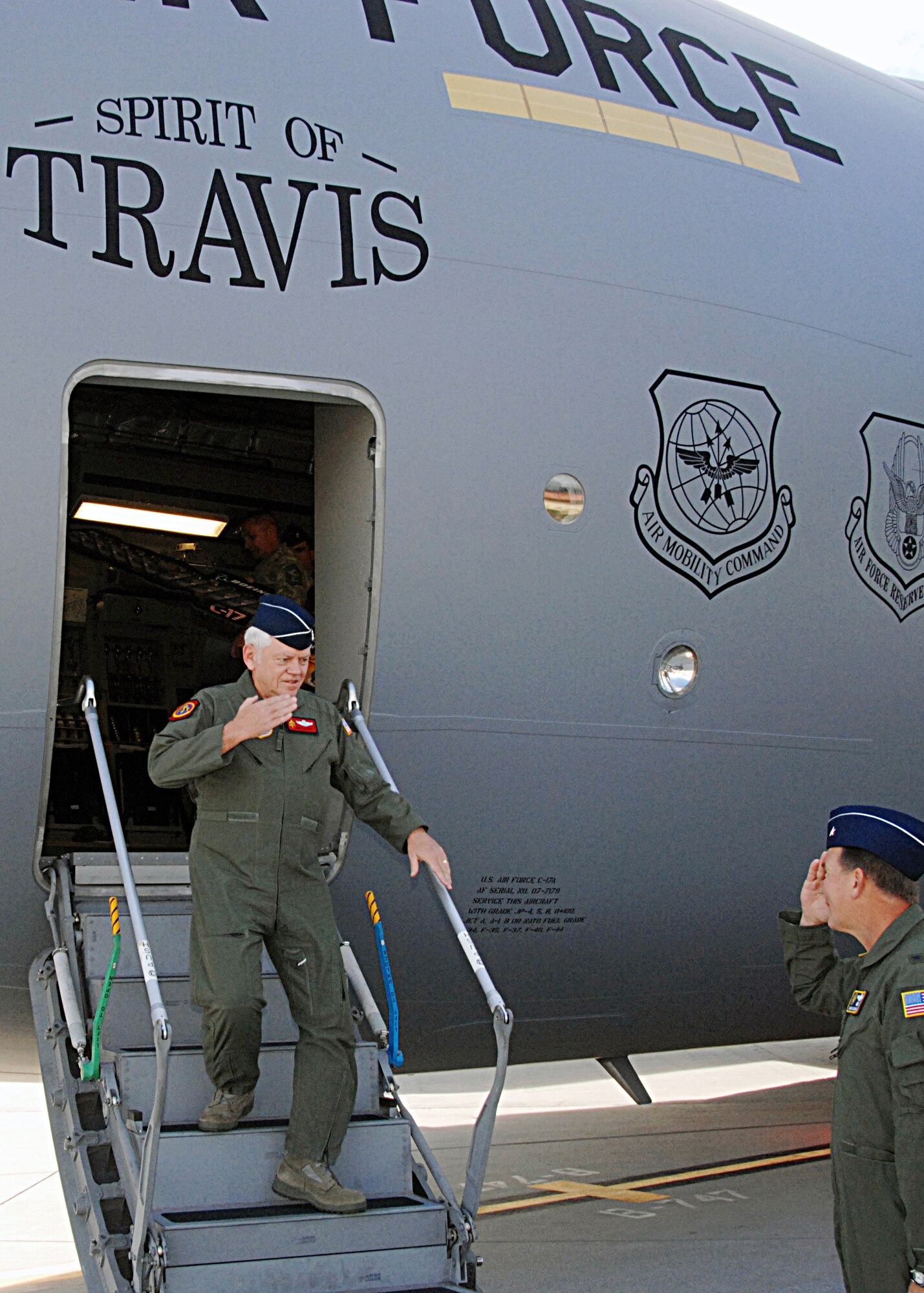 Gen. ArthurJ. Lichte, Air Mobility Command commander, is greeted by Brig. Gen. Mark Stearns, 15th Expeditionary Mobility Task Force commander, as he steps out of "The Spirit of Travis," Travis Air Force Base's final C-17 Globemaster III Nov. 5. (U.S. Air Force photo/Dave Cushman)