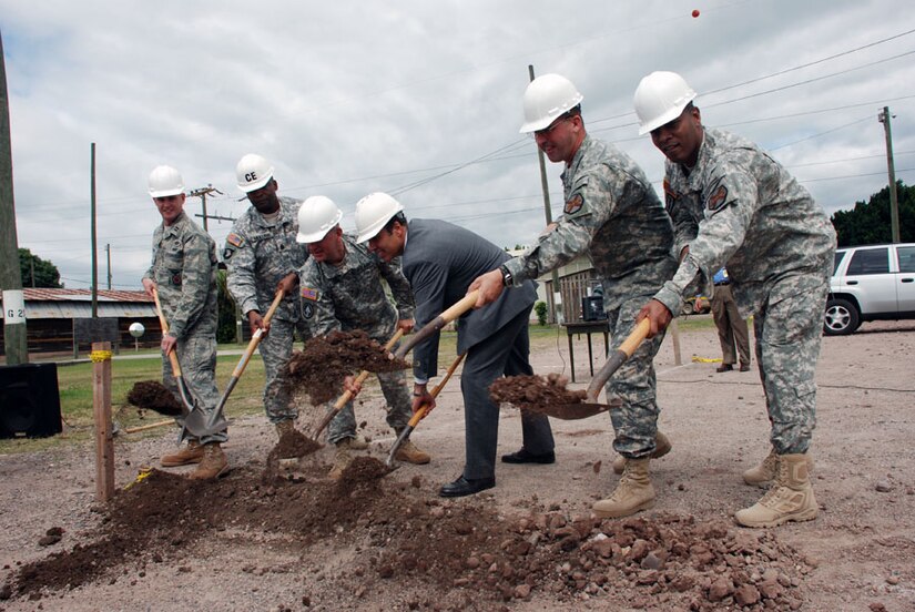SOTO CANO AIR BASE, Honduras - Leadership from Joint Task Force-Bravo and Ambassador Hugo Llorens break ground Nov. 4 for construction of a new dining facility here. The old DFAC was constructed in 1987 and was meant to be temporary. It is scheduled to open March 2010. (U.S. Air Force photo by Staff Sgt. Joel Mease)