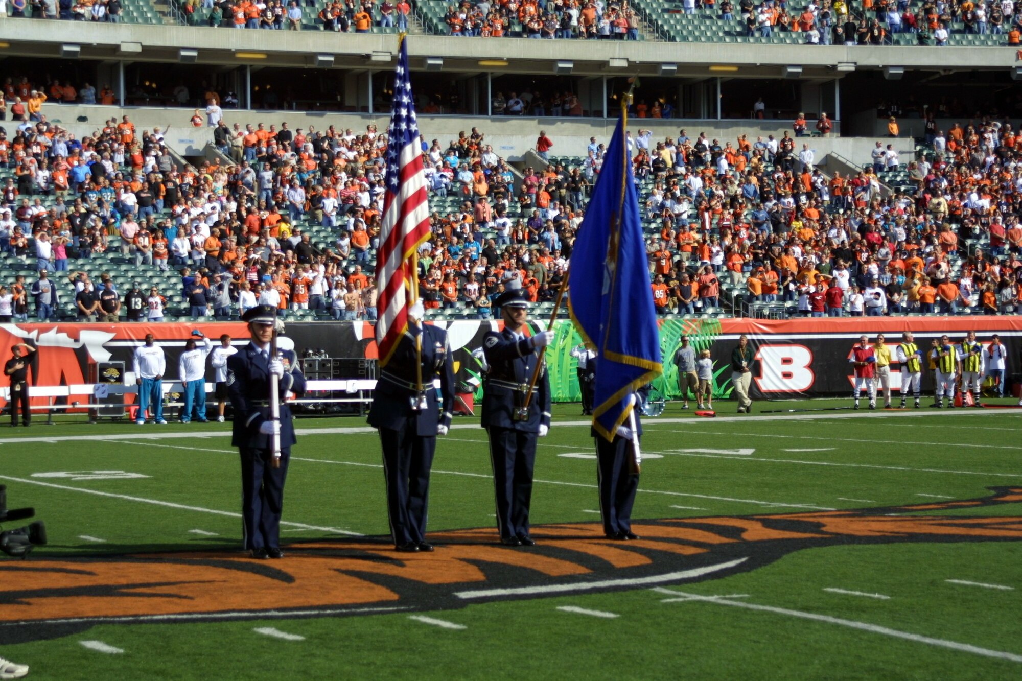 WRIGHT-PATTERSON AFB, Ohio - The 445th Airlift Wing had a strong presence at the Cincinnati Bengals' Paul Brown Stadium Nov. 2, 2008.  The 445th Honor Guard posted the colors and the wing performed an exciting C-5 Galaxy flyover before the Bengals football game Nov. 2, 2008. Members of the Honor Guard, from left to right, are Master Sgt. Aaron Wallenburg, 89th Airlift Squadron; Master Sgt. Michael Bailey, 87th Aerial Port Squadron, Master Sgt. Ed Engle, 445th Operations Support Squadron; and Senior Airman Carol Walker, 88th Air Base Wing.  (Courtesy photo/Cincinnati Bengals)