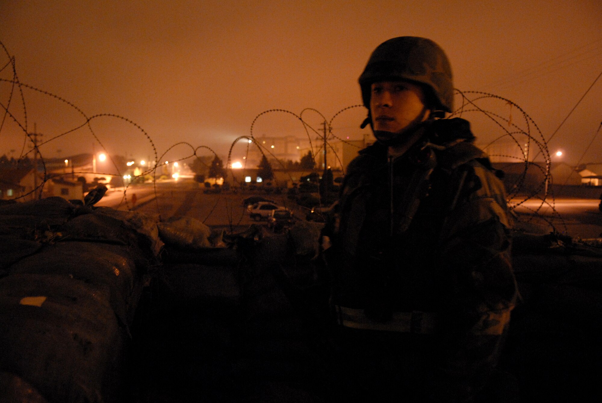 Staff Sergeant Adam Tappy, 8th Communications Squadron, guards his unit  during the peninsula-wide operational readiness exercise Beverly Bulldog 08-04, at Kunsan Air Base, Republic of Korea, Nov. 6, 2008. Kunsan Airmen were tested on their wartime capabilities and response actions in order to complete the Wolf Pack mission. U.S. Air Force photo by: Senior Airman Angela Ruiz)