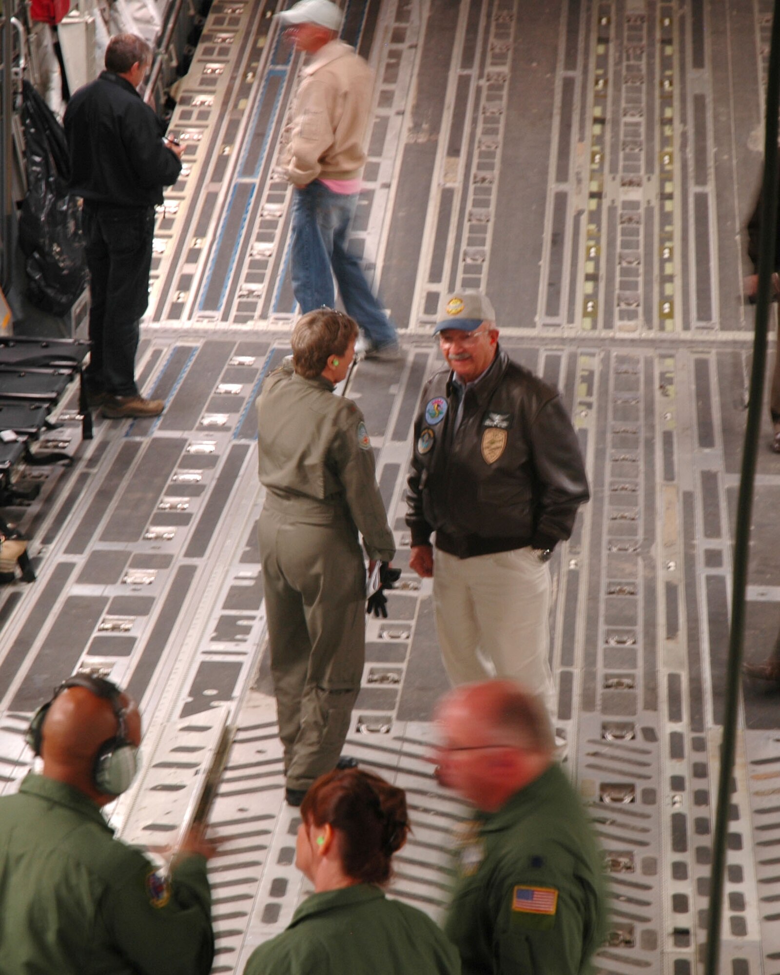 Bill McPherson (center), city adminsitrator of Cripple Creek, Colo., and a civic leader, talks with a member of the aeromedical evacuation aircrew while experiencing a ride on a C-17 Globemaster III Oct. 30. A group of 25 civic leaders were sponsored by the 302nd Airlift Wing during a community relations tour to McChord Air Force Base, Wash., where they learned more about the Air Force Reserve mission. The 302nd AW is based out of Peterson AFB, Colo. (U.S. Air Force photo/Senior Airman Stephen Collier)