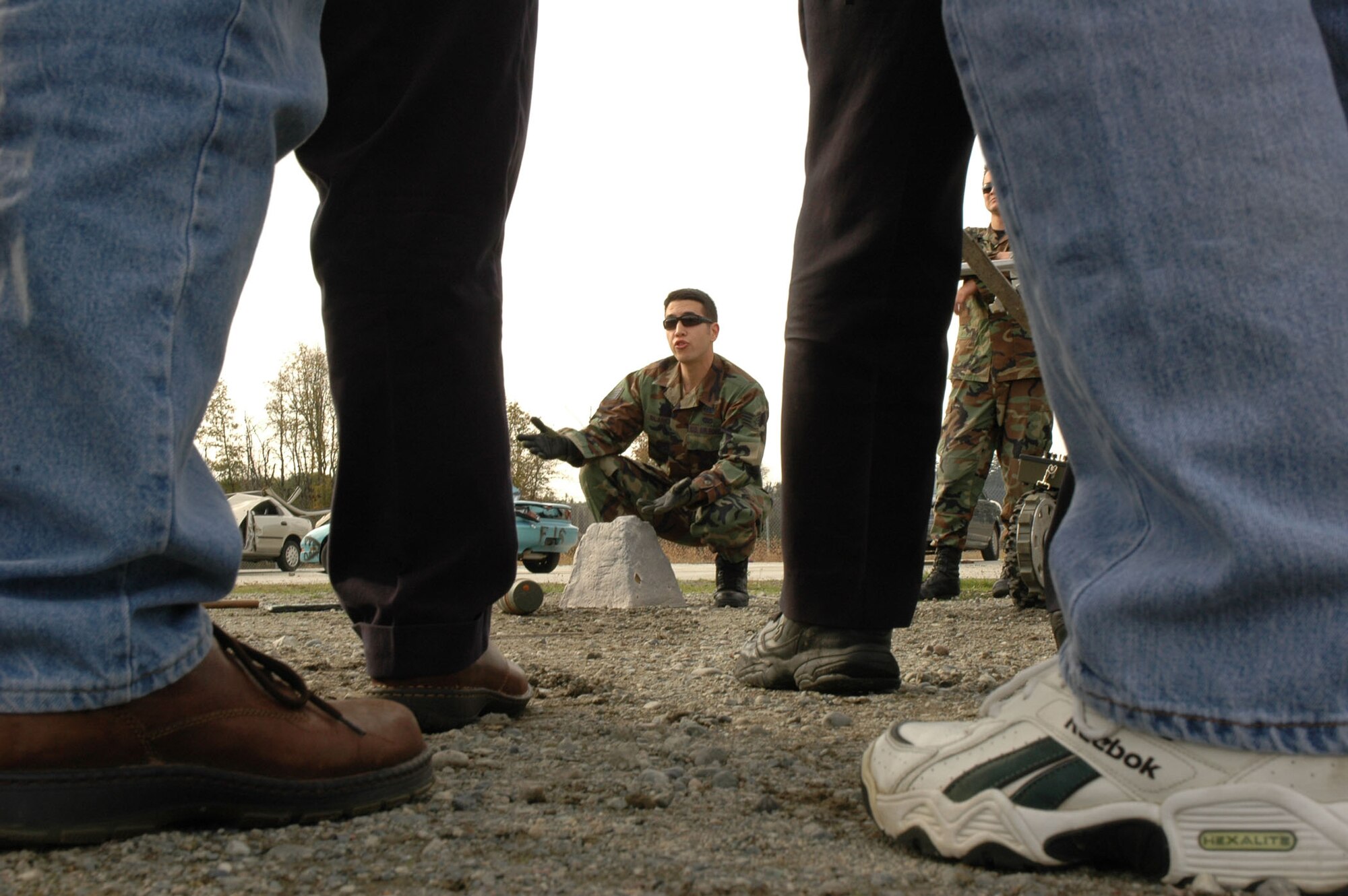 Staff Sgt. Michael Blanch, 62nd Civil Engineer Squadron explosives ordnance disposal technician, explains the inner workings of an improvised explosives device Oct. 30 at McChord Air Force Base, Wash. A group of 25 civic leaders were sponsored by the 302nd Airlift Wing during a community relations tour to the Northwest base where they learned more about the Air Force Reserve mission. The 302nd AW is based out of Peterson AFB, Colo. (U.S. Air Force photo/Senior Airman Stephen Collier)