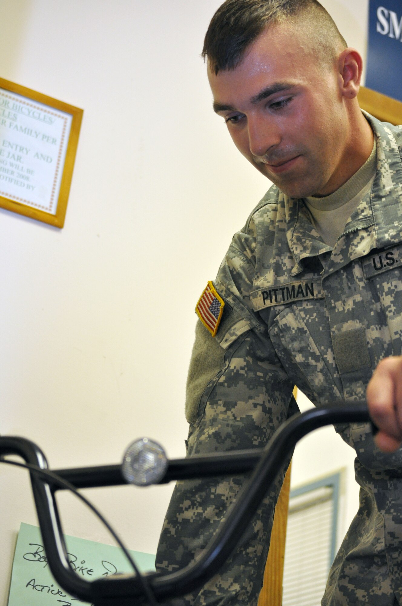 EGLIN AIR FORCE BASE, Fla. --Pvt. Matt Pittmanl, a Soldier in advanced individual training at the Explosive Ordnance School here, collects donations at the Airman's Attic and helps redistribute them within the store. (U.S. Air Force photo/Airman Chris Jacobs)