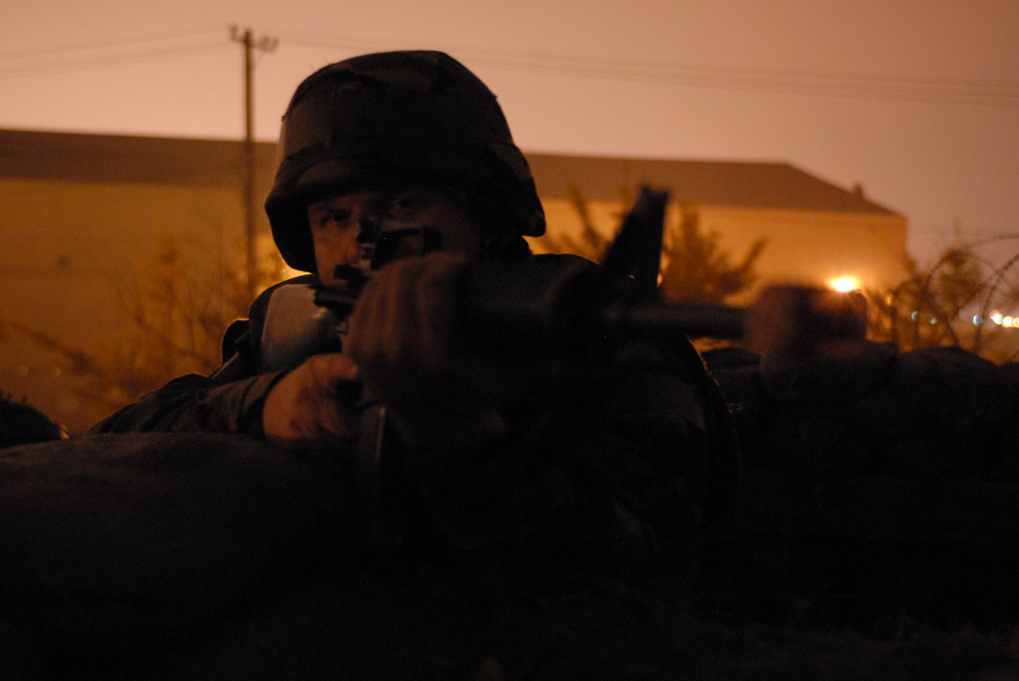 Technical Sergeant Richard Thompson, 8th Communications Squadron, guards the 8th Communications Squadron during the peninsula-wide operational readiness exercise Beverly Bulldog 08-04, at Kunsan Air Base, Republic of Korea, Nov. 6, 2008. Kunsan is participating in the PENORE as a test of its wartime capabilities and response actions. (U.S. Air Force Photo by Senior Airman Gustavo Gonzalez)