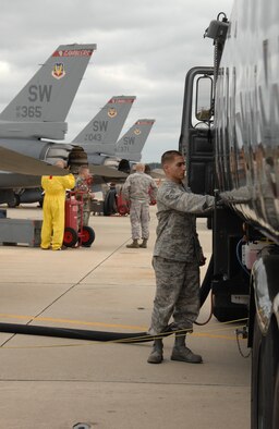 SHAW AIR FORCE BASE, S.C. -- Senior Airman David Harris, who works with petroleum, oil, and lubricants distribution, uses a hybrid refueler truck to refuel an F-16 here Nov. 5. The hybrid refueler is the only of its kind in the Air Force. U.S. Air Force photo/2nd Lt. Emily Chilson