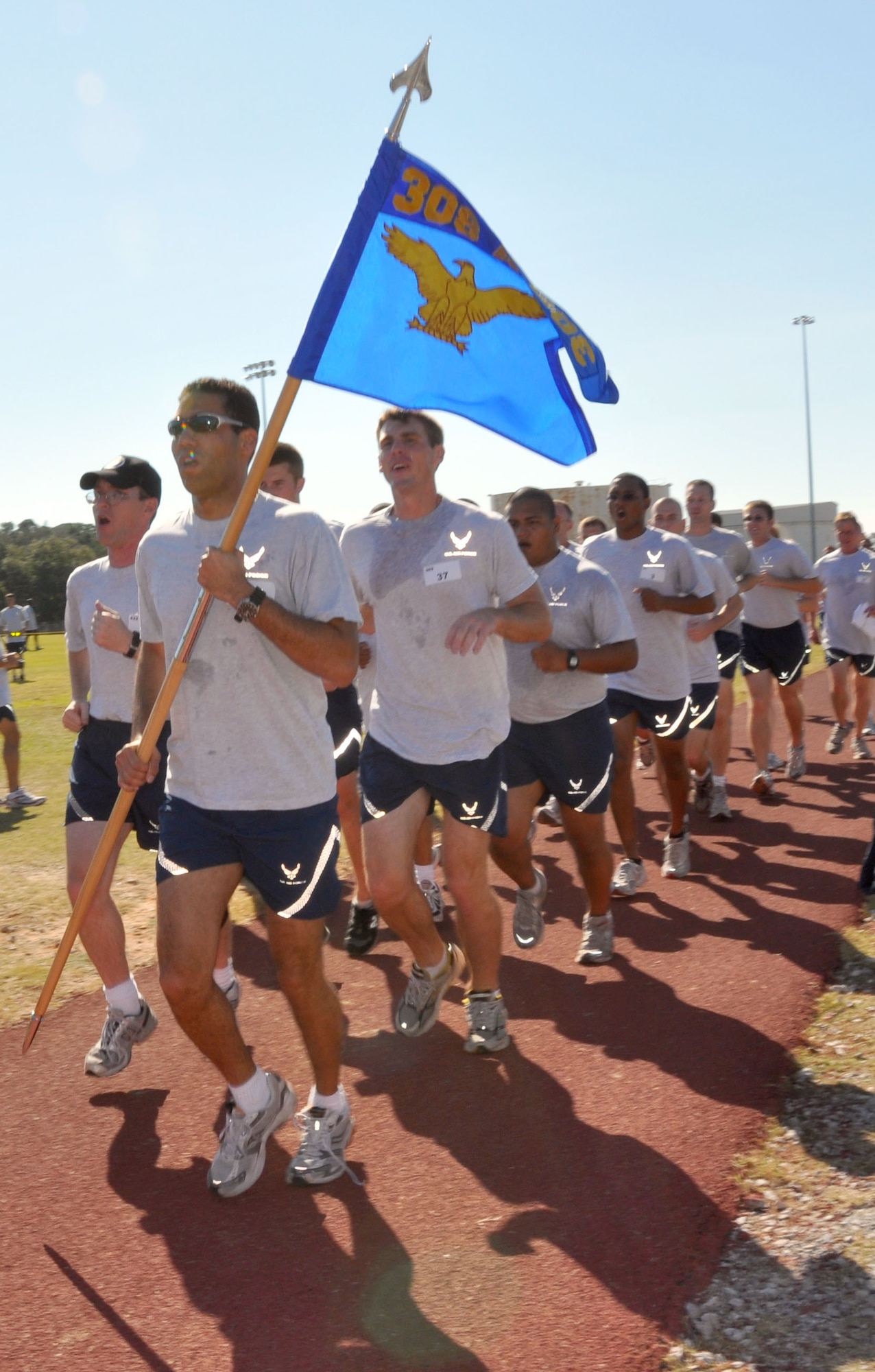 EGLIN AIR FORCE BASE, Fla. -- Members fromt he 308th Airmament Systems Group run a final leg around the track at Foster Stadium Nov. 6 at the close of the Wingman Day events. (U.S. Air Force photo/Staff Sgt. LuCelia Ball)
