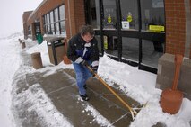 MINOT AIR FORCE BASE, N.D. -- John Swedlund, a base commissary employee, shovels snow from the commissary walkway during Minot’s first blizzard of the season here, Nov. 6. Minot AFB is no stranger to winter wonderlands as the annual snowfall is around 40 inches.  Almost every imaginable type of weather can occur at Minot AFB. In general, conditions tend to be cold, dry and windy, but residents have adapted and persevere proving “only the best come north.” (U.S. Air Force photo by Senior Airman Joe Rivera)