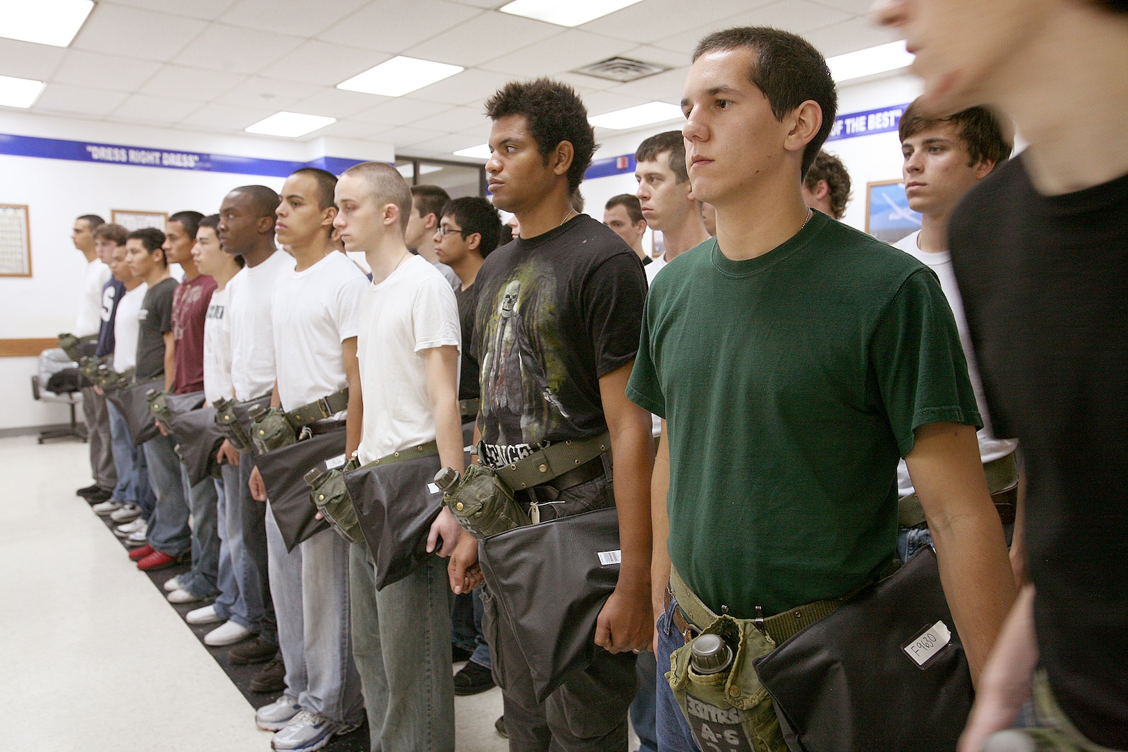 11/5/2008 - Air Force Basic Military Training trainees from the 331st Training Squadron, Flight 077, wait in line for haircuts Nov. 5. They are is among the first group of Air Force recruits to experience an additional 14 days of training as BMT expands from 6.5 to 8.5 weeks. The additional time will enhance and reinforce current war skills training. (USAF photo by Robbin Cresswell)  