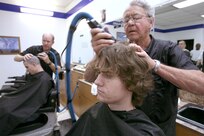 11/5/2008 - Daryl Treadwell, 331st Training Squadron, Flight 077, gets a haircut Nov. 5. He is among the first group of Air Force recruits to experience an additional 14 days of training as BMT expands from 6.5 to 8.5 weeks. The additional time will enhance and reinforce current war skills training. (USAF photo by Robbin Cresswell)  