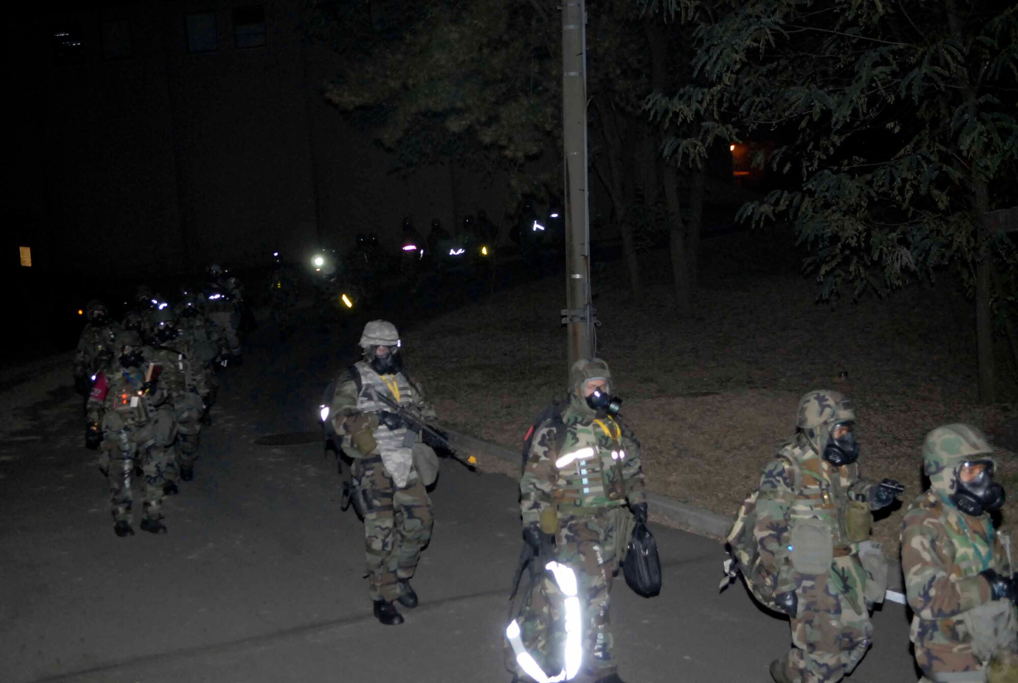 OSAN AIR BASE, Republic of Korea – 51st Fighter Wing personnel evacuate to an alternate location following a simulated chemical missile attack during Exercise Beverly Bulldog 08-04 Nov. 6. The week-long exercise tests Team Osan’s readiness and ability to execute combat operations, receive follow-on forces and defend the base from attack. (U.S. Air Force photo/Staff Sgt. Scottie McCord)