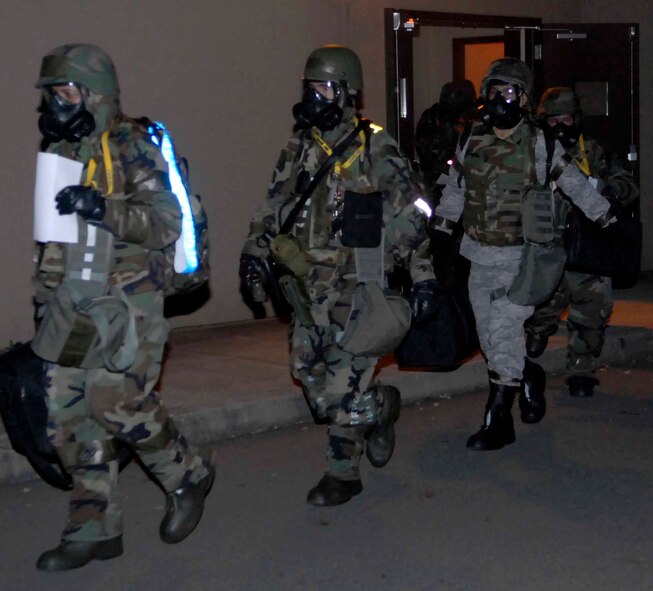 OSAN AIR BASE, Republic of Korea – 51st Fighter Wing personnel evacuate to an alternate location following a simulated chemical missile attack during Exercise Beverly Bulldog 08-04 Nov. 6. The week-long exercise tests Team Osan’s readiness and ability to execute combat operations, receive follow-on forces and defend the base from attack. (U.S. Air Force photo/Staff Sgt. Scottie McCord)