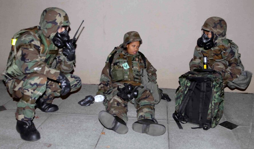 OSAN AIR BASE, Republic of Korea –PAR team members radio in to their unit control center after finding an “injured” Airman during a post-attack reconnaissance sweep as part of Exercise Beverly Bulldog Nov. 6. (U.S. Air Force photo/Staff Sgt. Scottie T. McCord)