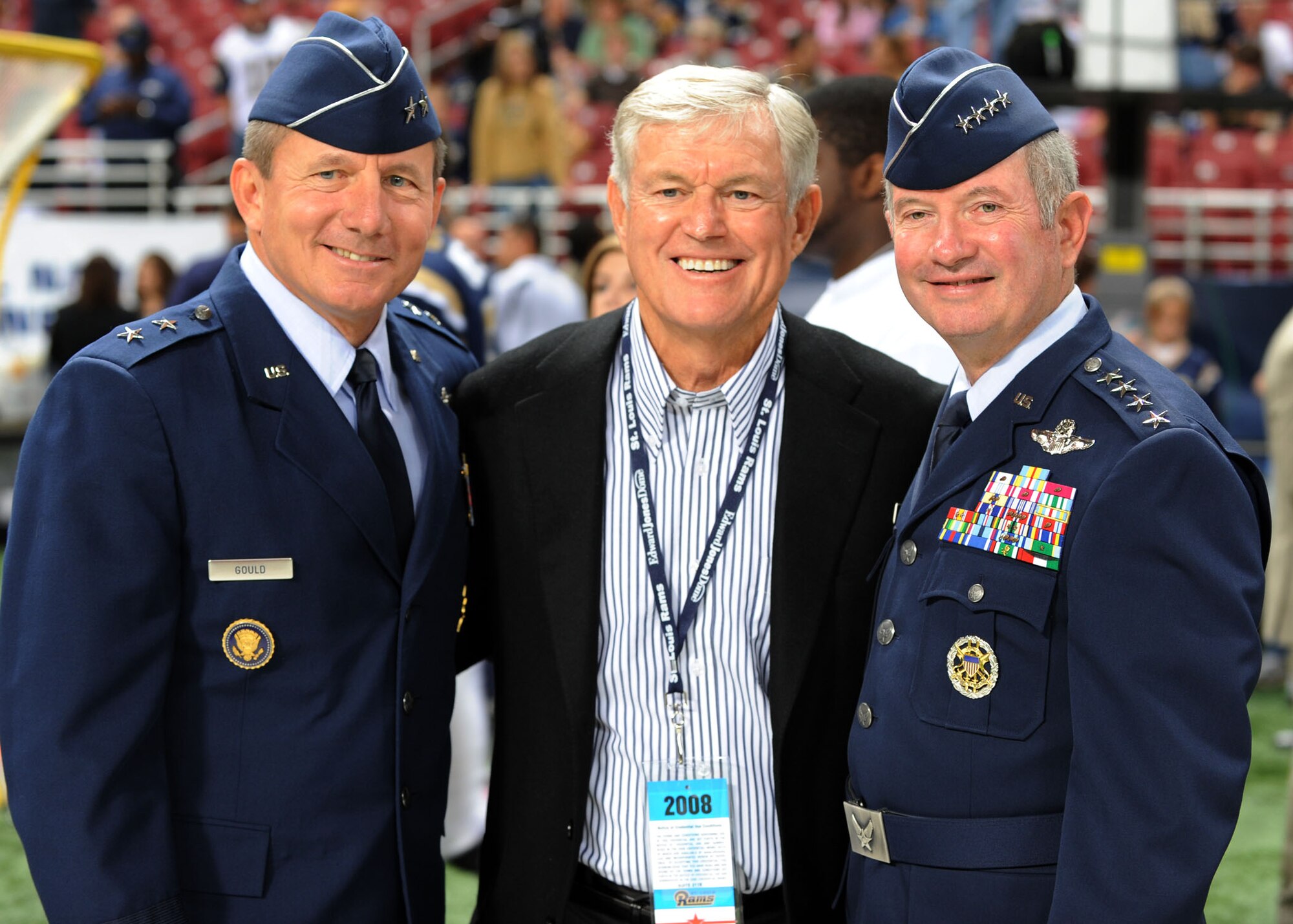 SCOTT AIR FORCE BASE, Ill. -- Gen. Duncan J. McNabb (right), U.S. Transportation Command commander, and Maj. Gen. Mike Gould, U.S. TRANSCOM director of operations and plans pose for a photo with former Rams’ head coach, Dick Vermeil, before the game. Mr. Vermeil, who lead the Rams to a Super Bowl victory in 1999, was inducted into the Rams’ Ring of Honor during a halftime ceremony. (U.S. Air Force photo/Airman 1st Class Wesley Farnsworth) 