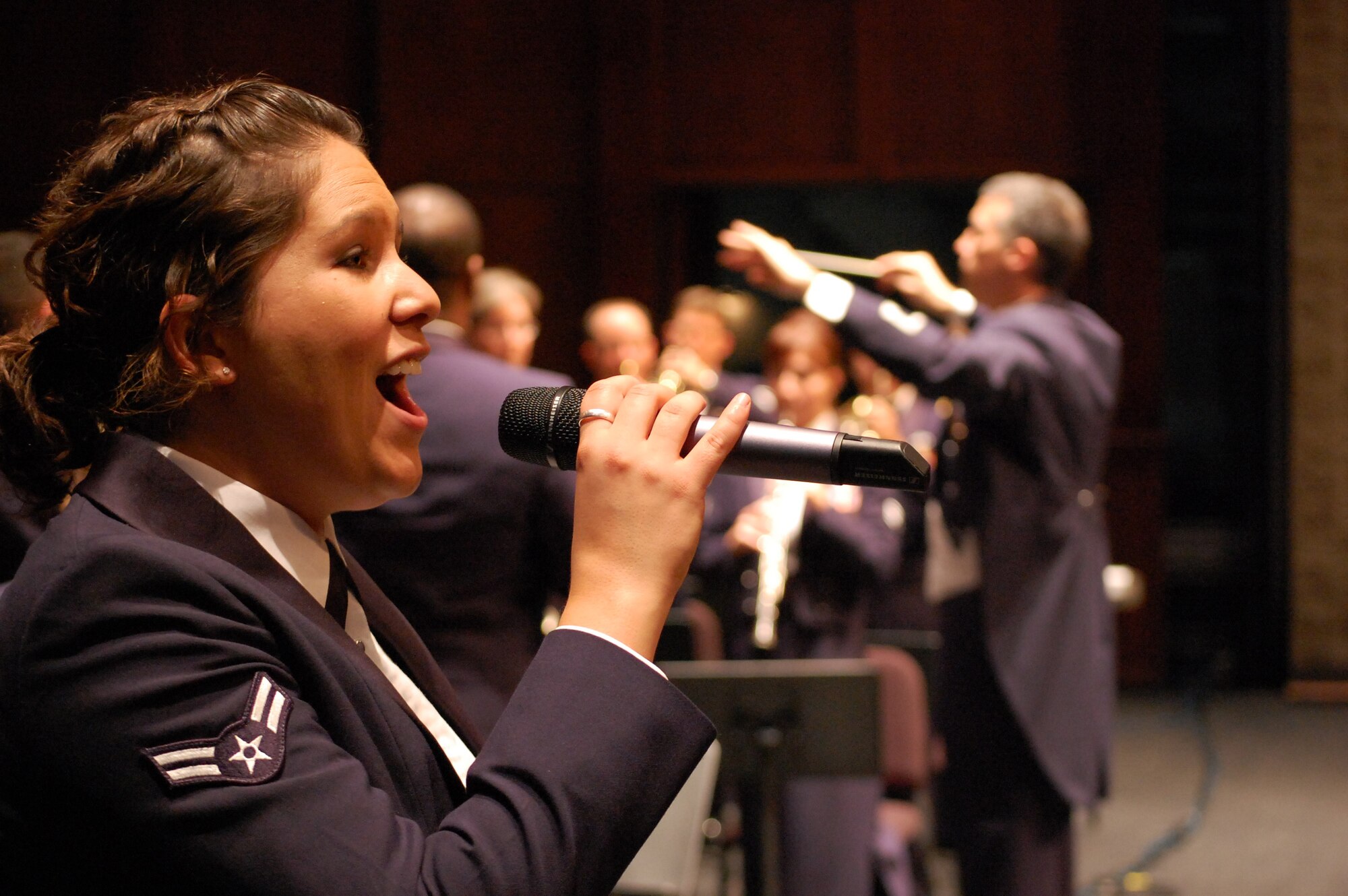 LANGLEY AIR FORCE BASE, Va. -- Airman 1st Class Amy Aguilera, U.S. Air Force Heritage of America Band vocalist, will perform "Believe,” an original composition by Staff Sgt. Natalie Madison, U.S. Air Force Heritage of America Band vocalist, at the Salute to Veterans Concert Nov. 8. (U.S. Air Force Photo/ Staff Sgt. Craig Bowman) 
