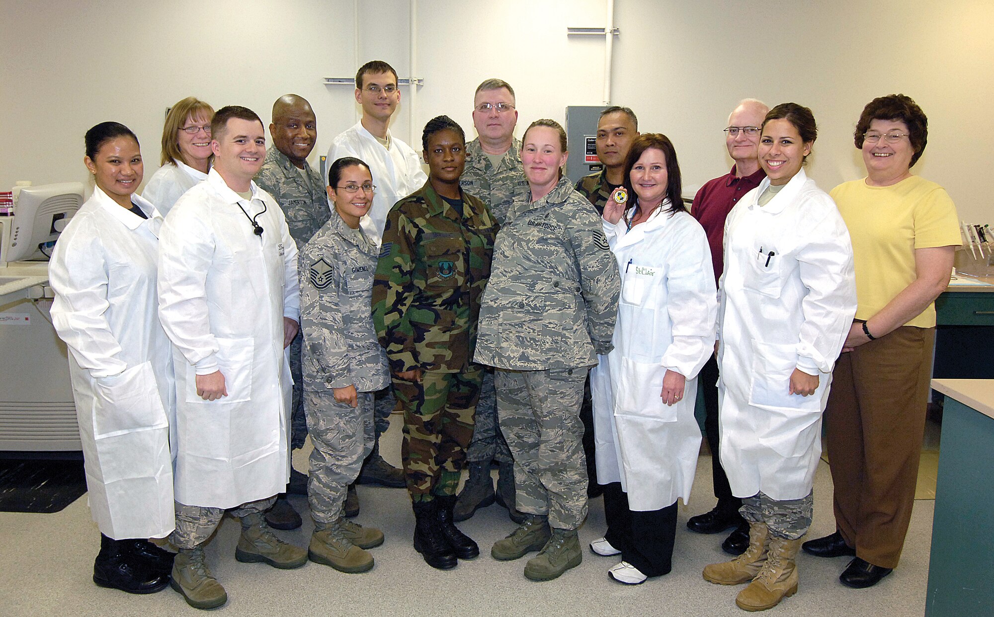 The College of American pathologists recently visited the Tinker Clinic’s lab for a no-notice inspection. The lab passed a checklist of 777 items with only two “minor” discrepancies. The lab was recognized with commander’s coins from the 72nd Air Base Wing commander, Col. Allen Jamerson. Front Row (left to right):  Staff Sgt. Milette Palanca, Staff Sgt. Maurice McDaniel, Master Sgt. Carol Gimenez, Tech. Sgt. Avri McKnight, Tech. Sgt. Crystal Spedding, Ms. Elizabeth St Clair, Staff Sgt. Rebecca Miller. Back Row (left to right):  Lori Cranford, Col. Allen Jamerson, Airman 1st Class Michael Johnson, Maj. Marcus Jimmerson, Maj. Lorenzo Gabiola, Richard Scott and Sue Kuritz.(Air Force photo/Margo Wright)