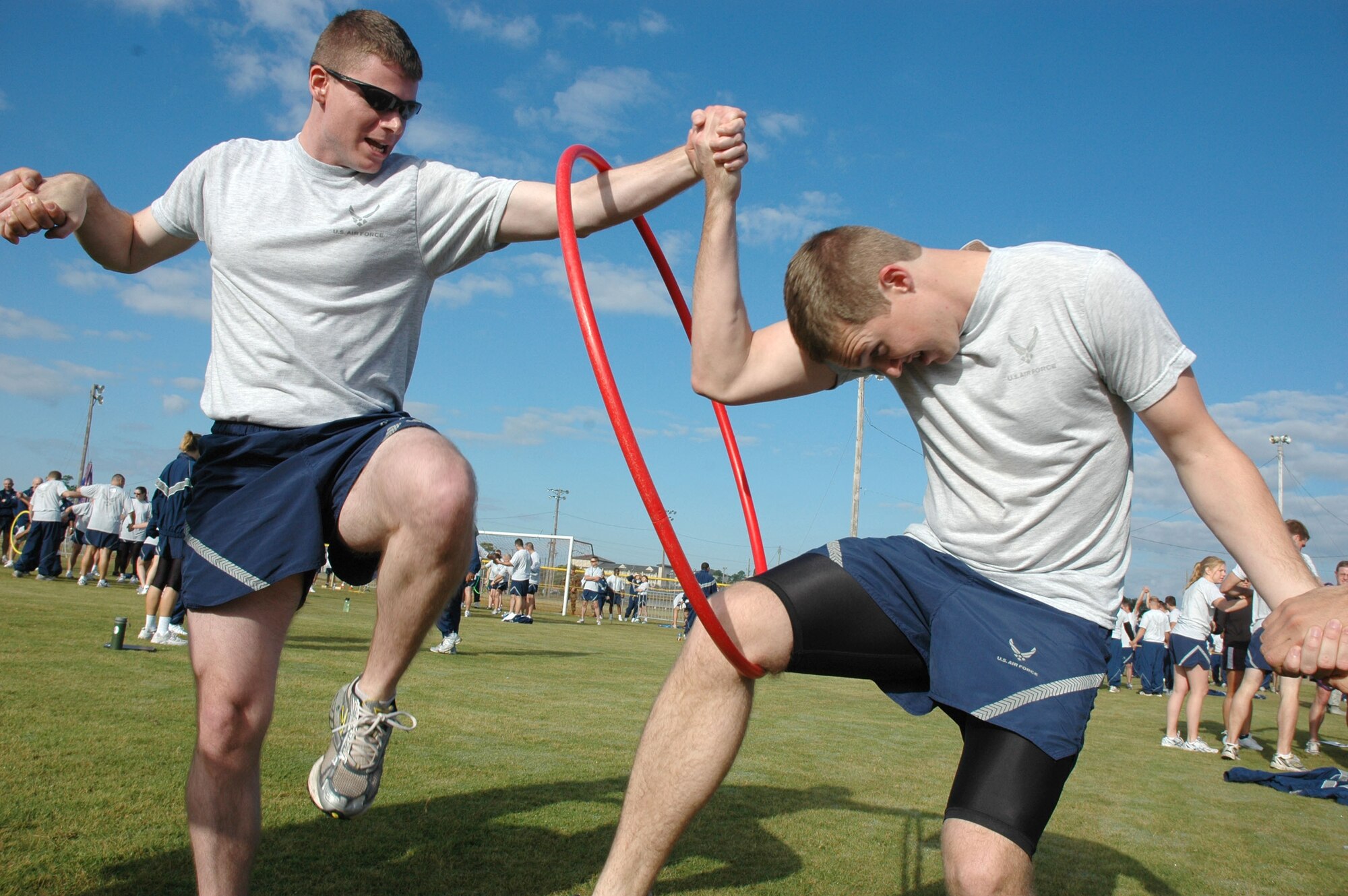 EGLIN AIR FORCE BASE, Fla. -- Airmen from Team 5 representing the 36th Electronic Warfare Squadron perform the Hoop Challenge. Wingman Day is a day of teambuilding exercises and other events aimed at fostering the Wingman concept of looking out for fellow Airmen. (U.S. Air Force photo/Staff Sgt. Stacia Zachary)