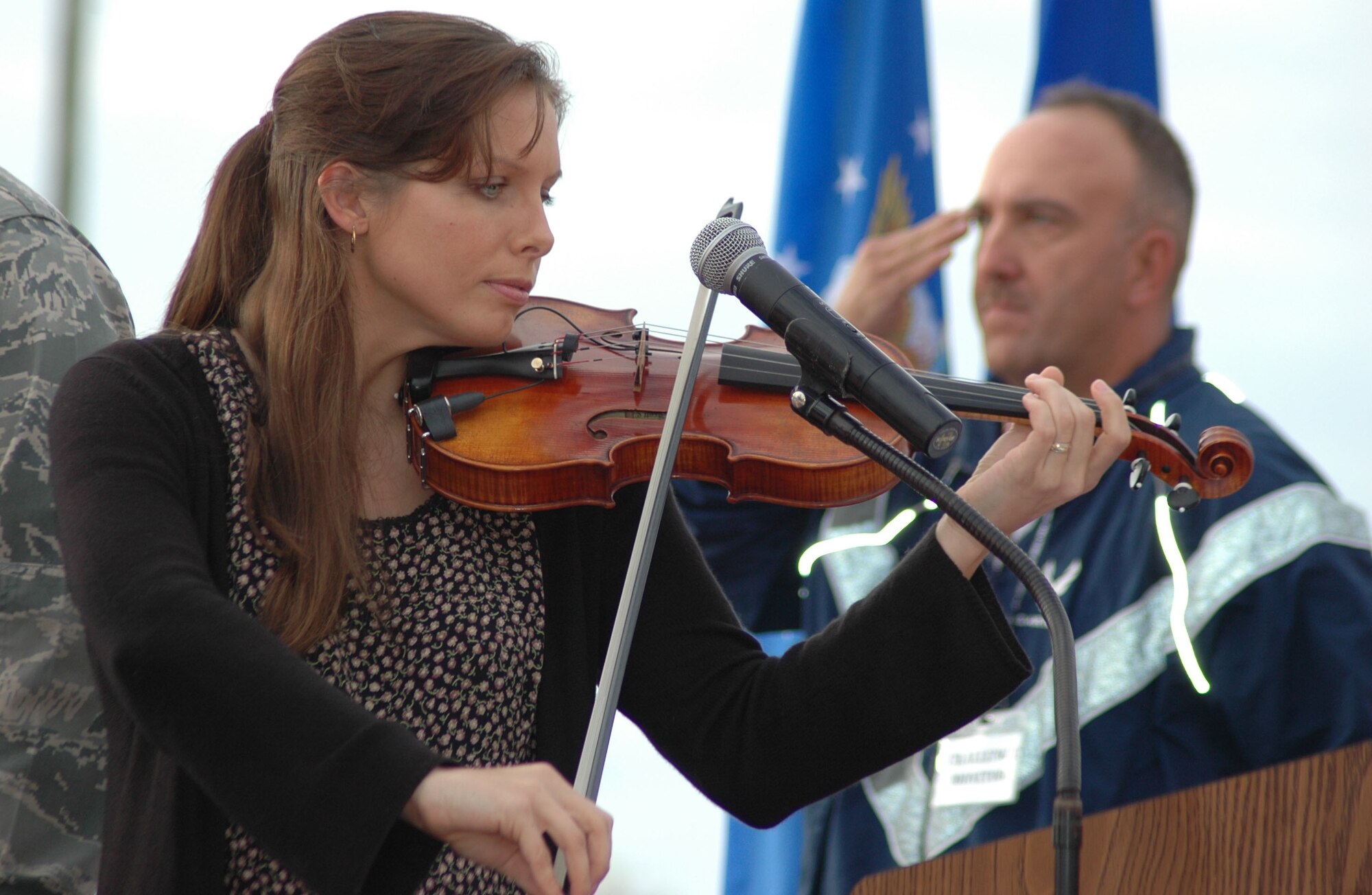 EGLIN AIR FORCE BASE, Fla. -- Andrea Campbell plays the violin during the opening ceremony of Wingman Day Nov. 6 at Foster Stadium. Wingman Day is a day of teambuilding exercises and other events aimed at fostering the Wingman concept of looking out for fellow Airmen. (U.S. Air Force photo/Staff Sgt. Stacia Zachary)