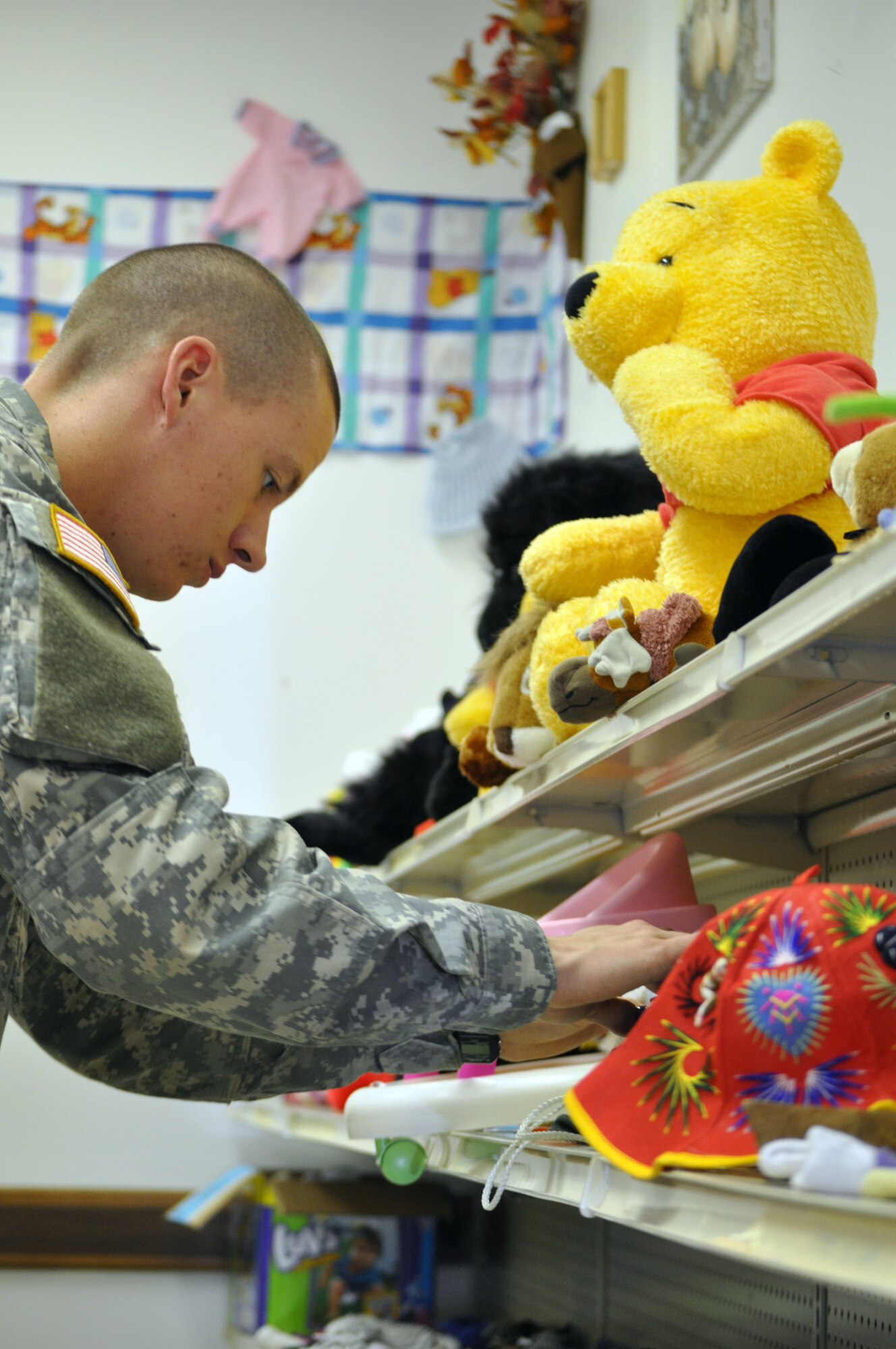 EGLIN AIR FORCE BASE, Fla. -- Pvt. Dane Cole, a Soldier in advanced individual training at the Explosive Ordnance School here, collects donations at the Airman's Attic and helps redistribute them within the store. (U.S. Air Force photo/Airman Chris Jacobs)