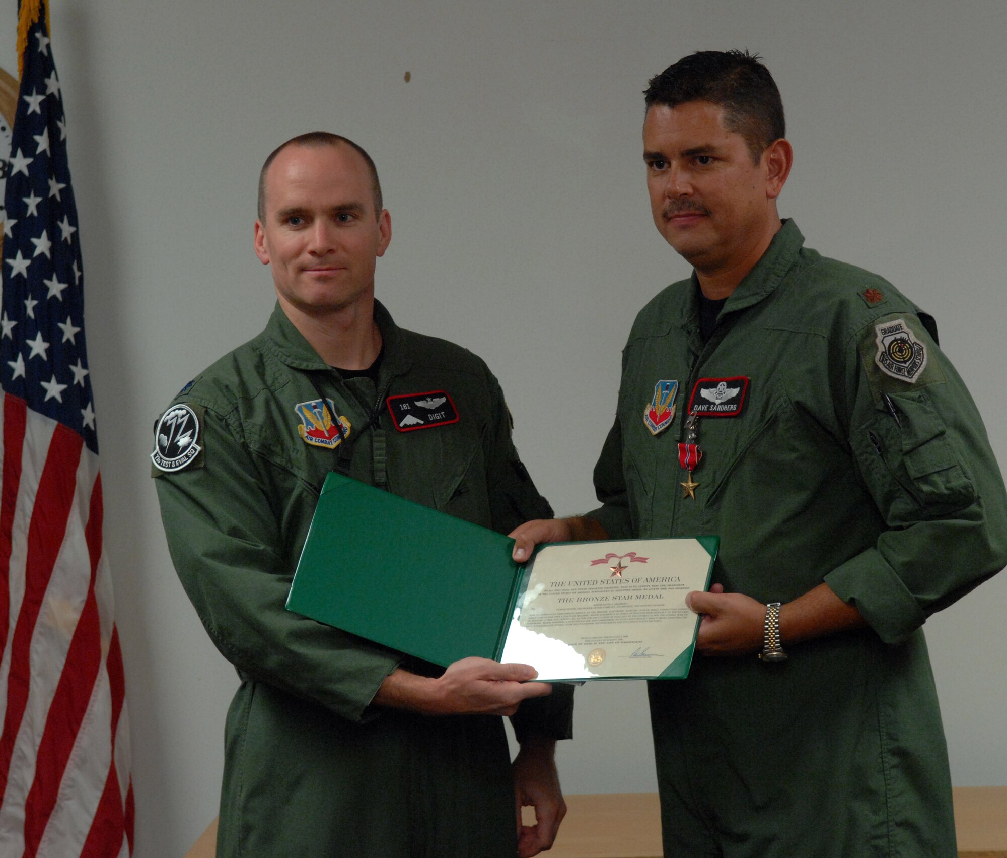 WHITEMAN AIR FORCE BASE, Mo – Maj. David Sandberg, 72nd Test and Evaluation Squadron, receives a Bronze Star from Lt. Col. Matthew Snyder, 72nd TES, Oct. 31. The Bronze Star Medal is a United States Armed Forces individual military decoration which may be awarded for bravery, acts of merit, or meritorious service. When awarded for bravery, it is the fourth-highest combat award of the U.S. Armed Forces and the 9th highest military award for combat or non-combat in the order of precedence of U.S. military decorations. (U.S. Air Force photo/Senior Airman Stephen Linch)