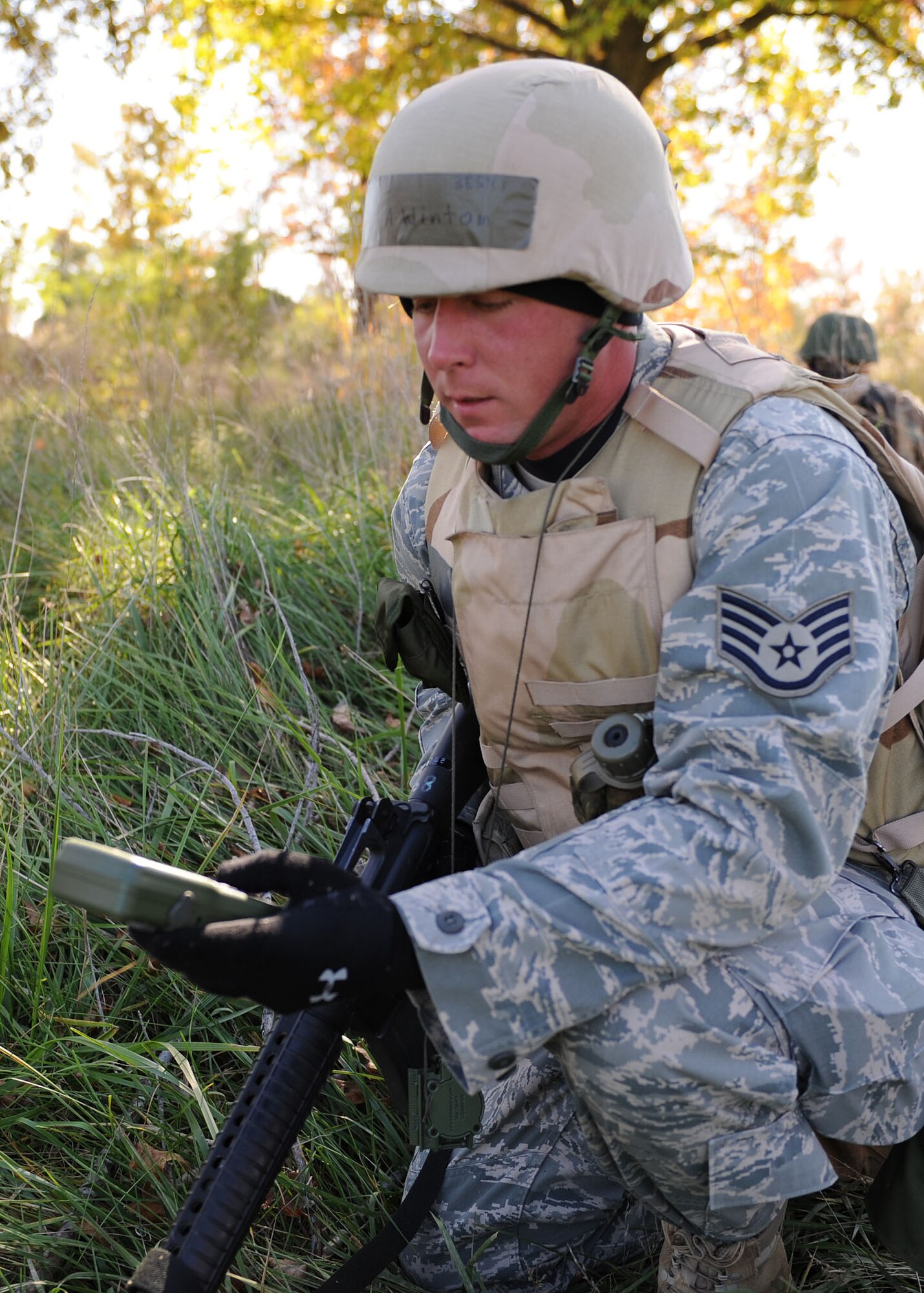 SCOTT AIR FORCE BASE, Ill. -- Staff Sgt. Andy Winton, 375th Civil Engineer Squadron, takes a dagger (GPS/Compass) reading to the next checkpoint during the 375th CES field training exercise.. (U.S. Air Force photo/Airman 1st Class Wesley Farnsworth) 