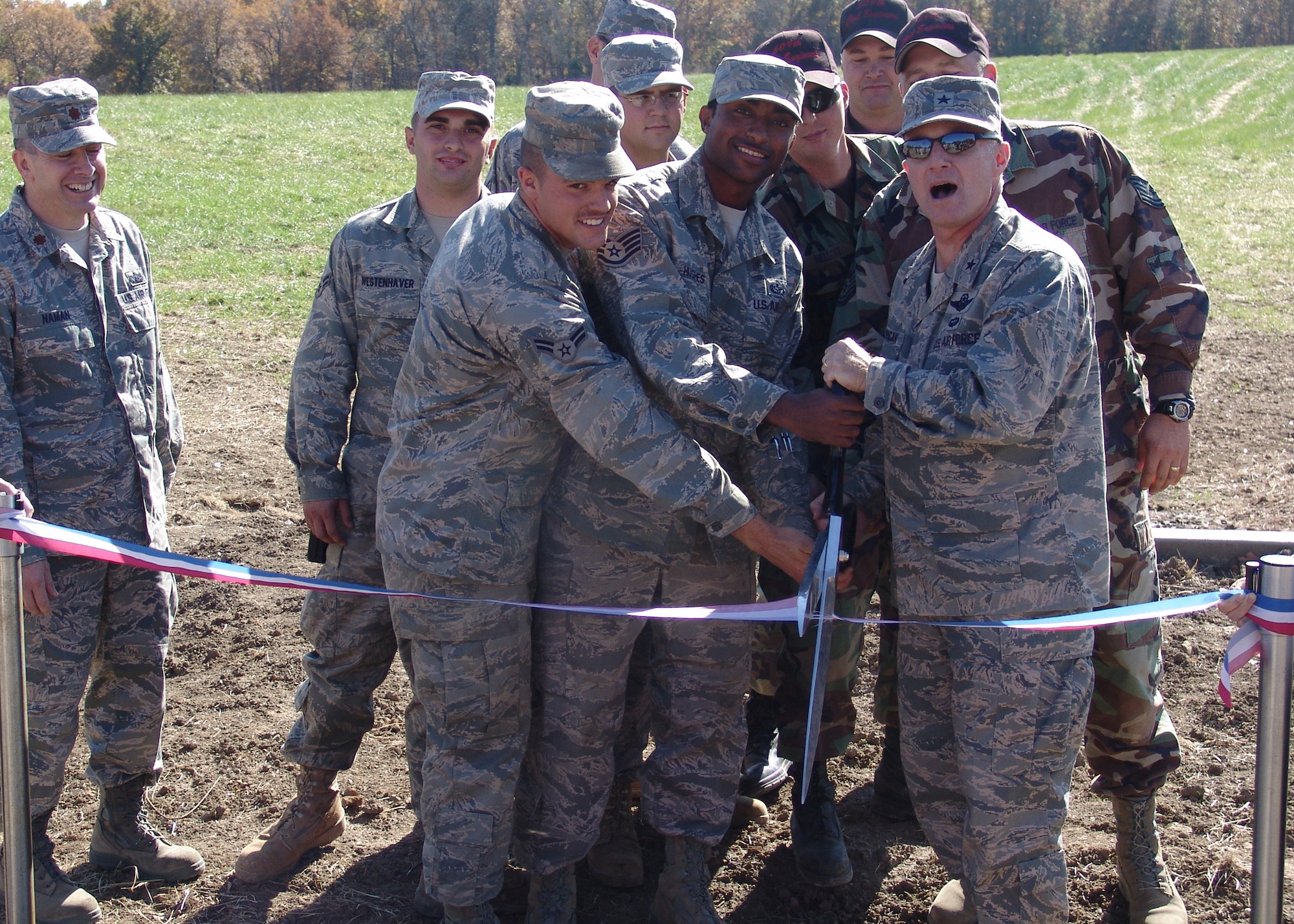 WHITEMAN AIR FORCE BASE, Mo. – Brig. Gen. Garrett Harencak, 509th Bomb Wing commander, cuts a ribbon at the Whiteman Trap Range ribbon cutting ceremony Oct. 30. Members of Team Whiteman can get the remote to operate the range from outdoor recreation during business hours. It is $30 annually, which includes use of the range and discounted targets. (U.S. Air Force photo/Jim Ward)