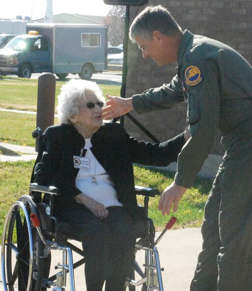 WHITEMAN AIR FORCE BASE, Mo. - Maj. Gen. Anthony Przybyslawski, Air Education and Training Commander vice commander, leans over to hug Maurine Achauer to thank her for all that she has done for the Whiteman Community as a long-time member of the Whiteman Base Community Council and Warrensburg Military Affairs Committee, two organizations focused on the morale and welfare of Whiteman service members. The recently renovated Distinguished Visitors' Lounge was dedicted to Ms. Achauer during a ceremony here Nov. 4.
