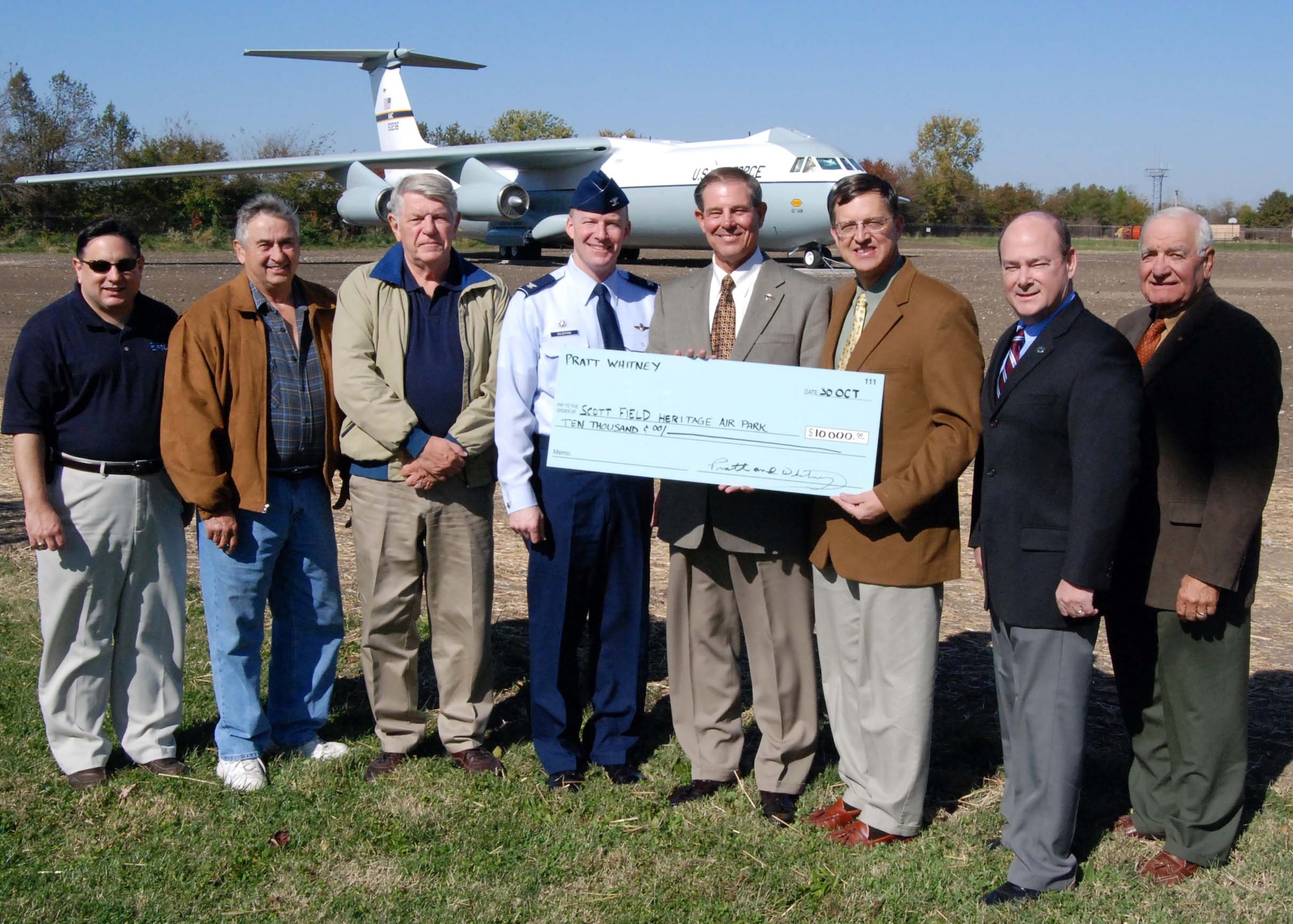 SCOTT AIR FORCE BASE, Ill. -- Scott Field Heritage Air Park board of directors members Geno Carvotta, Charles Treser and Ray Holden; Col. Gary Goldstone, 375th Airlift Wing commander; Nick Williams, Pratt and Whitney St. Louis region general manager; Larry Strube, air park board of directors president, Jim Simpson, Pratt and Whitney St. Louis region assistant manager; Bob Dintelmann, Air Park Board of Directors immediate past president. (Courtesy photo/Dave Thurston)