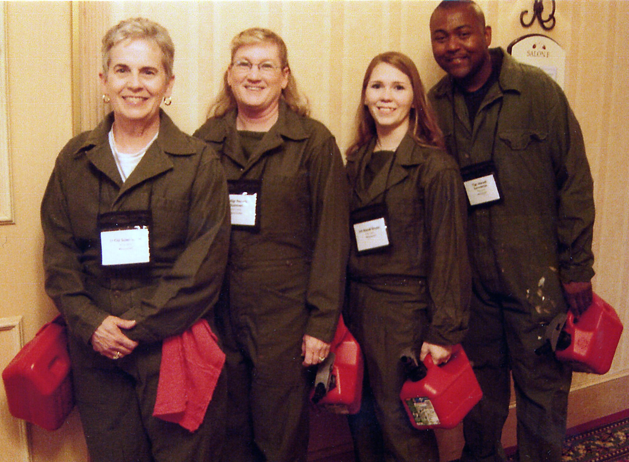 (Left to right) Lt. Col. Sue Lovas, Senior Master Sgt. Pam Summers, Senior Airman Brandi Brooks, and Tech. Sgt. Marvell Summerow represented the 931st Air Refueling Group at a Human Resource Development Council workshop in Atlanta. Dressed as gas station attendants, they earned an award for best representing the air refueling heritage of their unit. (Courtesy photo)