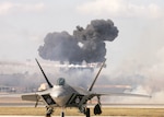 11/1/2008 - The Pearl Harbor reenactment of Tora! Tora! Tora! fills the sky with smoke behind the F-22 Raptor during AirFest 2008 at Lackland Air Force Base, Texas. (USAF photo by Robbin Cresswell) 