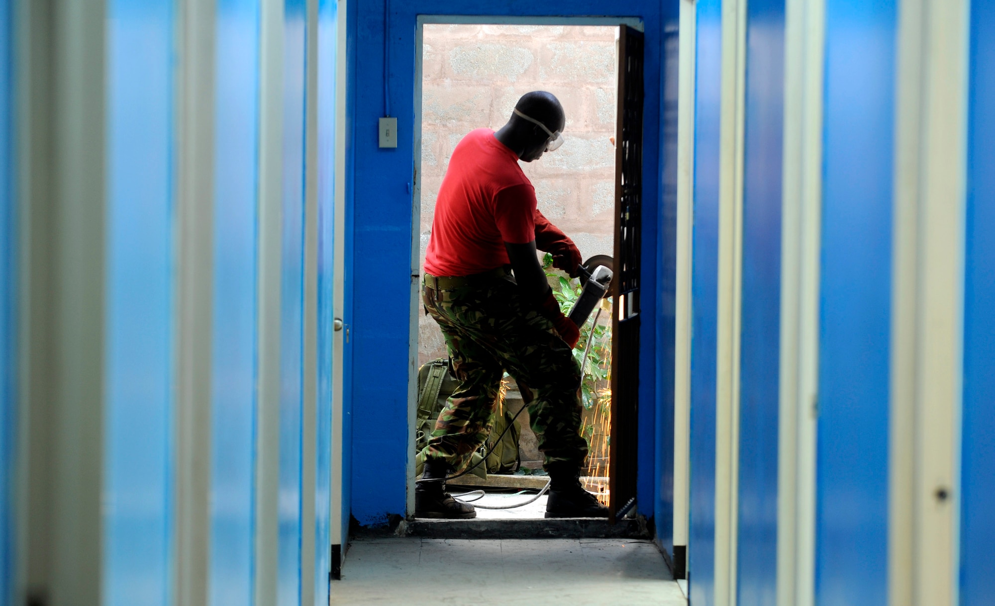 A Trinidad and Tobago engineer aids American servicemembers in repairing the St. Jude school in Port of Spain in support of Operation Continuing Promise 2008 Nov. 4 in Port of Spain, Trinidad and Tobago. (U.S. Air Force photo/Master Sgt. Cecilio Ricardo) 