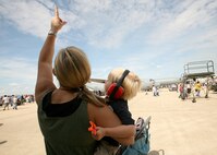 11/1/2008 - Two AirFest visitors look to the sky at aerial acrobatics showcasing the military's might and highlighting air power heritage during AirFest 2008 at Lackland Air Force Base, Texas. (USAF photo by Robbin Cresswell)  