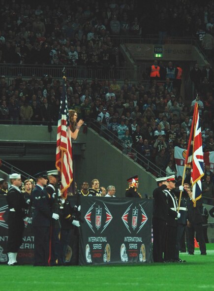 The JAC Honor Guard and their United Kingdom Counterparts flank the stage as English soul and R&B Singer Joss Stone sings "God Save the Queen." at the opening ceremonies of the New Orleans Saints vs. San Diego Chargers regular season NFL game October 26th in London's Wembley Stadium.  The "Star Spangled Banner" was sung by American R&B singer Ne-Yo. (U.S. Air Force Photo by Staff Sgt. Chad E. Chisholm)