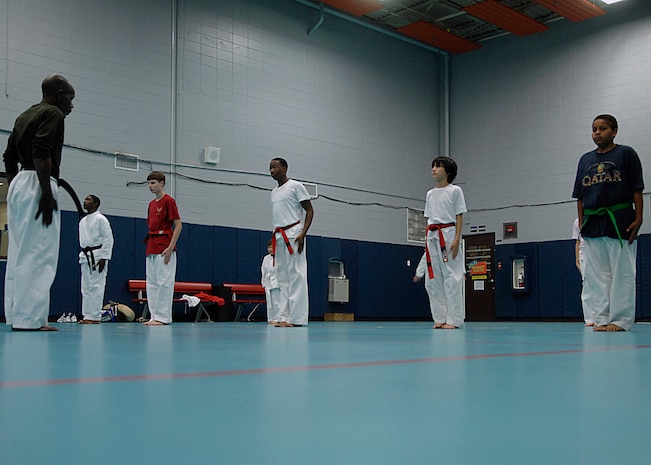 Mitch Jenkins prepares the Tae Kwon Do class for instruction at Youth Programs on Charleston AFB Nov. 5. Tae Kwon Do is part of FitFactor, which is a program designed to help keep children active. Mr. Jenkins is an instructor who has taught Tae Kwon Do at Youth Programs for 25 years. (U.S. Air Force photo/Airman 1st Class Katie Gieratz)
