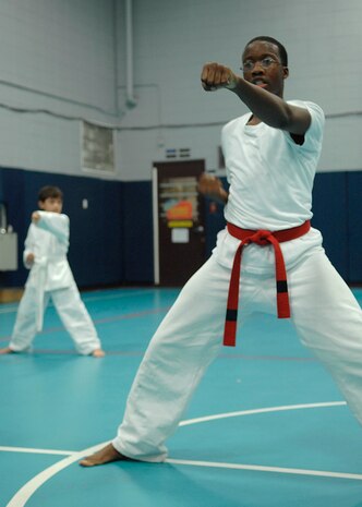 Kebar Morgan does a punching exercise during the Tae Kwon Do class at Youth Programs on Charleston AFB Nov. 5. Tae Kwon Do is part of FitFactor, which is a program designed to help keep children active. Kebar is the son of Marsha and retired Tech. Sgt. Cornelius Morgan. (U.S. Air Force photo/Airman 1st Class Katie Gieratz)
