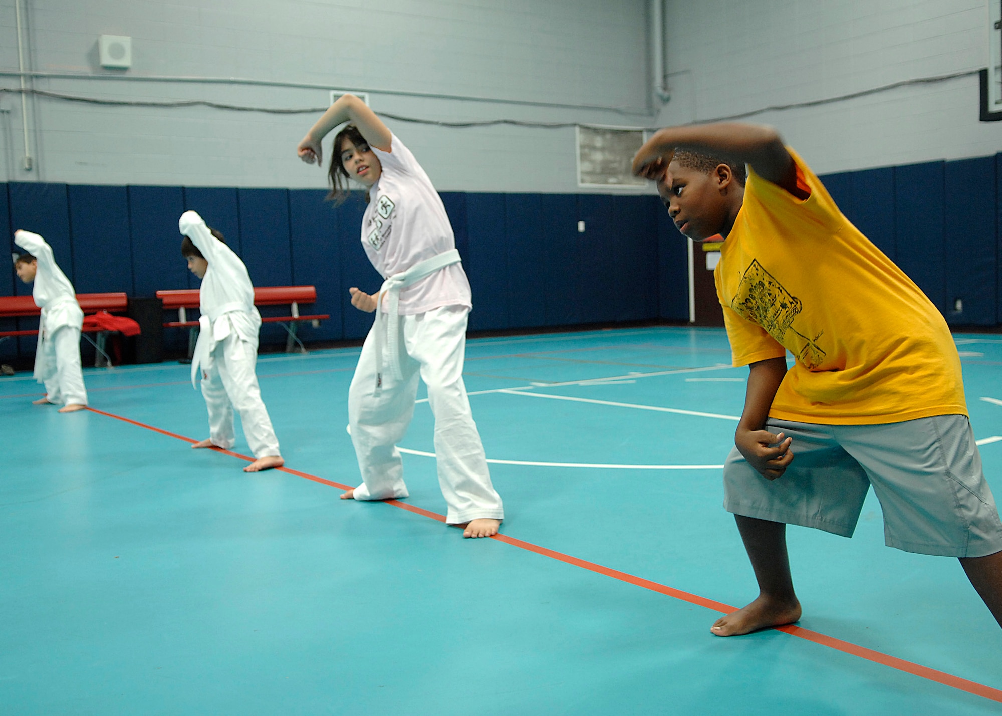 Team Charleston youths stretch in preparation for the Tae Kwon Do class at Youth Programs on Charleston AFB Nov. 5. Tae Kwon Do is part of FitFactor, which is a program designed to help keep children active. (U.S. Air Force photo/Airman 1st Class Katie Gieratz)
