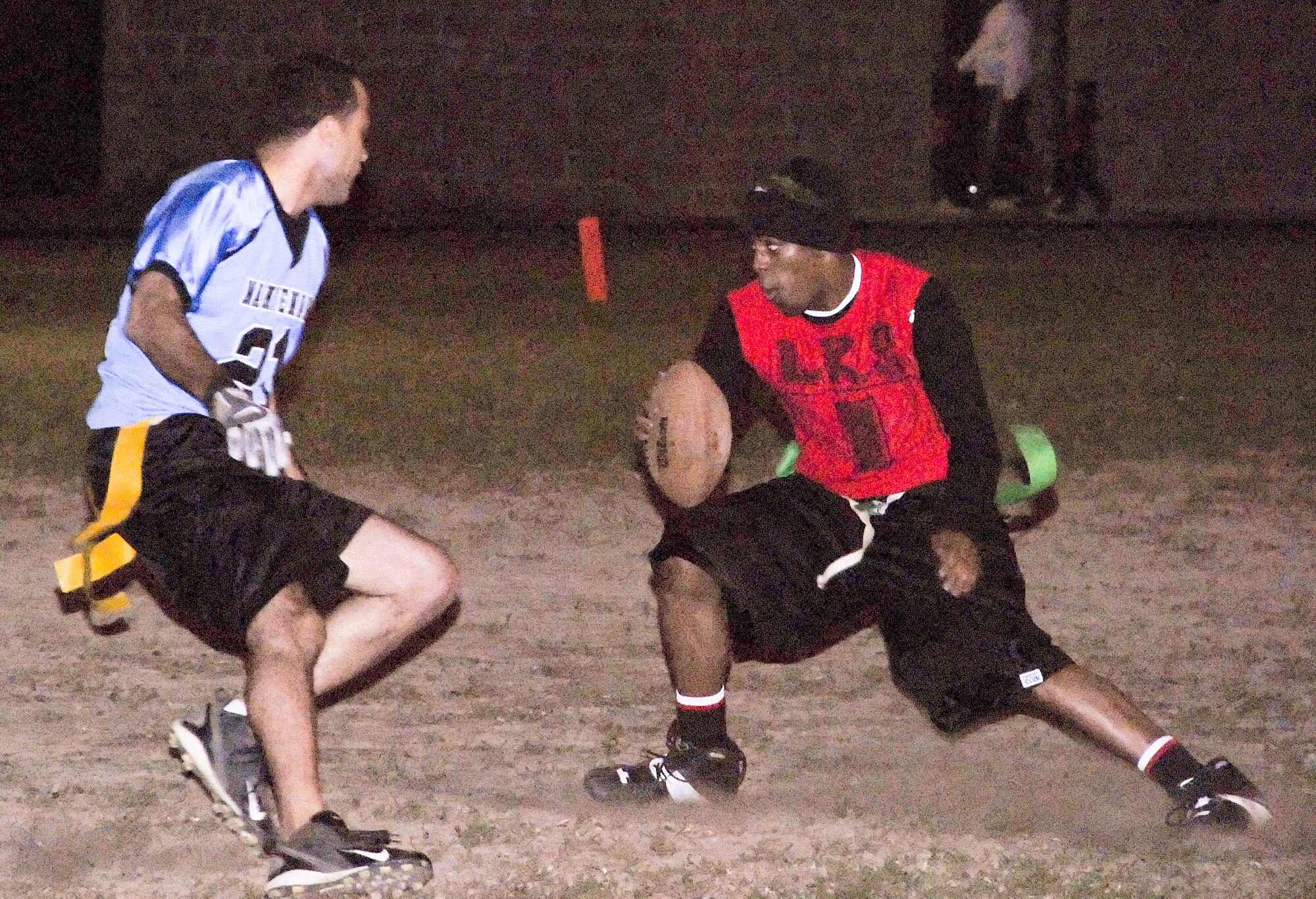 (Right) Cedric Middleton, LRS halfback, tries to shuffle past Barry Wilson, MXS rusher Nov. 3.  MXS defeated LRS 13-12.  (U.S. Air Force photo/Staff Sgt. Chad Padgett)