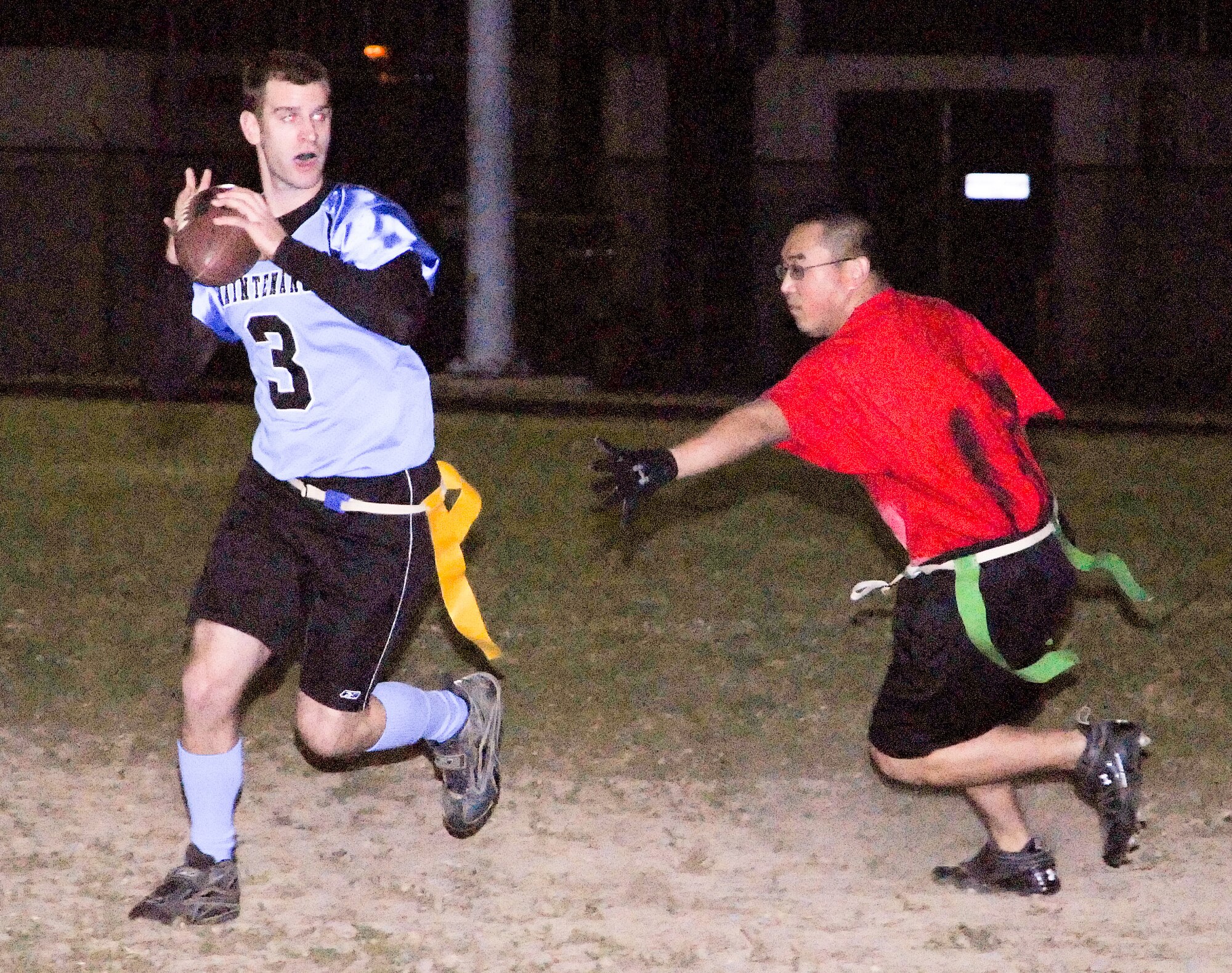 (Right) Malcum Horton, LRS safety, attempts to sack James Goerss, MXS quarterback, during their game Nov. 3.  MXS defeated LRS 13-12.  (U.S. Air Force photo/Joshua Padgett)