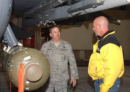 Technical Sgt. Billy Anderson from the 4th Maintenance Group briefs bassmaster pro-angler Marty Stone on weapons loading and the combat capabilities of the F-15E Strike Eagle, here Oct. 29 at Seymour Johnson Air Force Base, N.C. Mr. Stone toured the base prior to receiving an orientation flight to communicate the 4th Fighter Wing and United States Air Force mission to worldwide audiences.(US Air Force photo By Airman First Class Gino Reyes)  