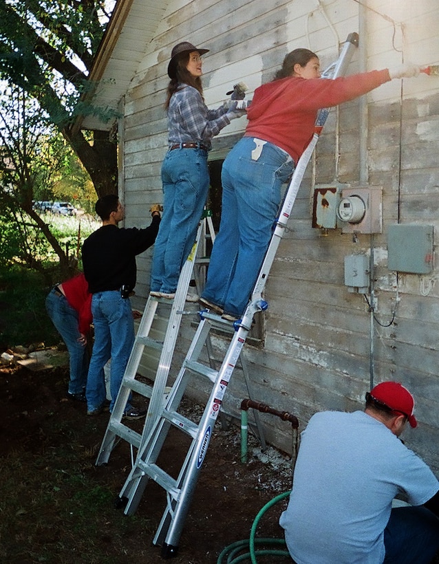 Volunteers from Vance Air Force Base and the local community participate in an organization called "Christmas in Action," by repairing the home of a local veteran. (Courtesy photo)