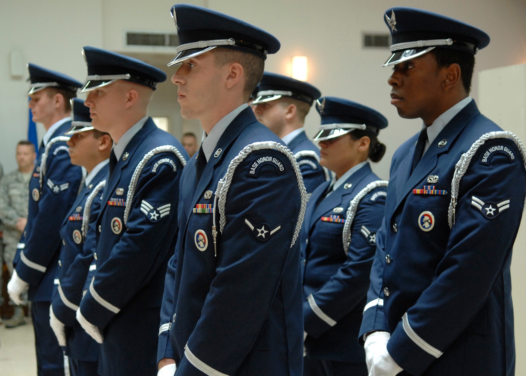 Members of the honor guard stand at parade rest after the ribbon cutting ceremony for their new training facility in Hunley Park Nov. 5. The honor guard relocated to a renovated building in Hunley Park to provide a better training environment. (U.S. Air Force photo/ Airman 1st Class Katie Gieratz)